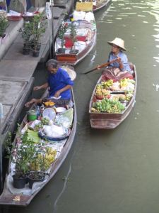 Typical floating market boats and merchants
