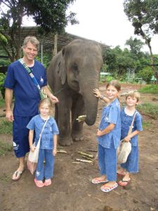 Feeding the elephants a treat of sugar cane to win them over (is that bribing?)