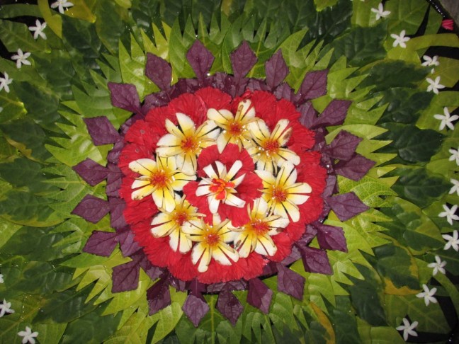 Balinese flower arrangement over water