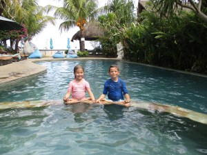 Little yogis in lotus pose by the pool...